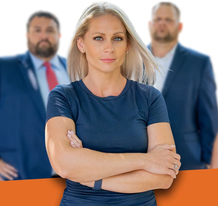Strong female lawyer with team of attorneys behind her