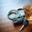 Whiskey with car keys and handcuffs